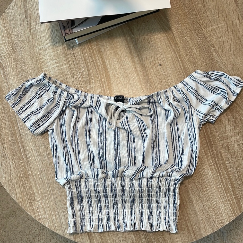 Off the shoulder small shirt.